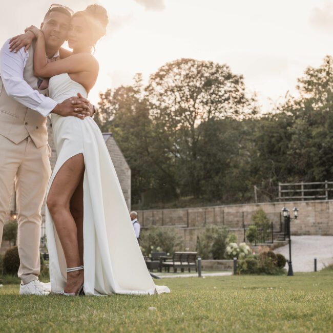 A bride and groom at walton view hotel during sunset