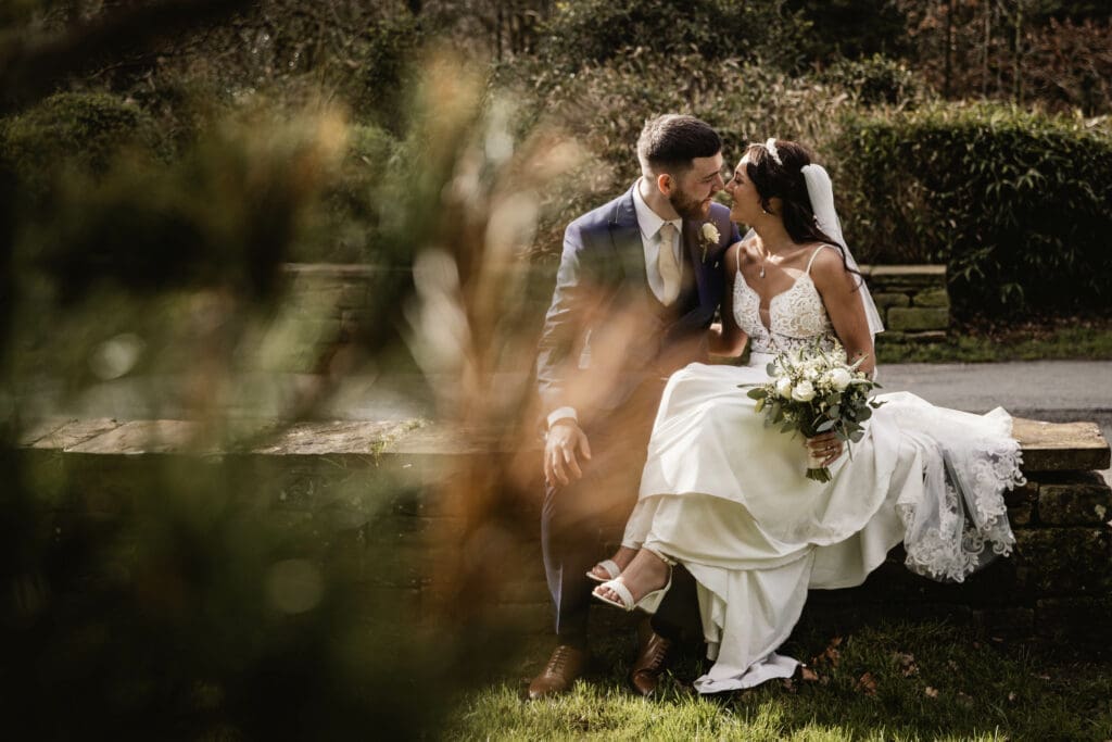 bride and groom kissing at riverbarn