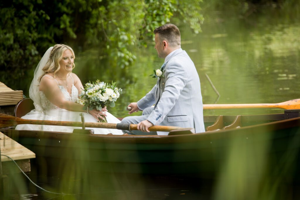 Bride and groom on boat rudding park hotel harrogate