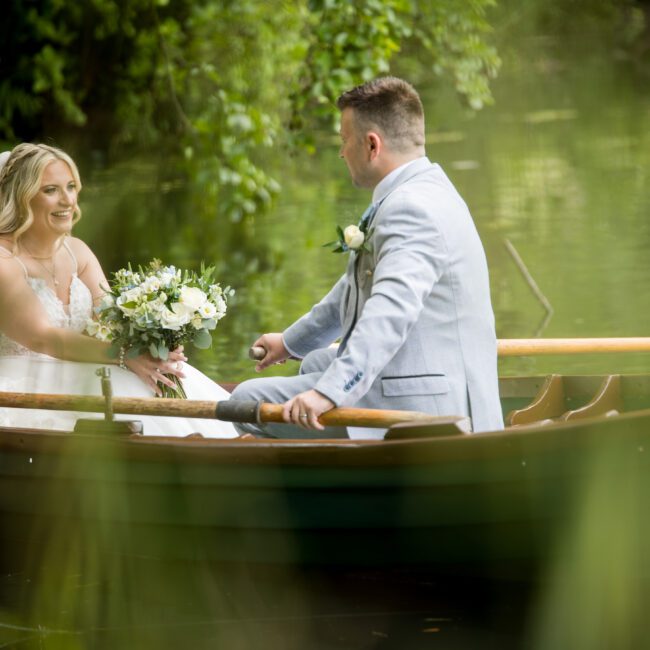 Bride and groom on boat rudding park hotel harrogate