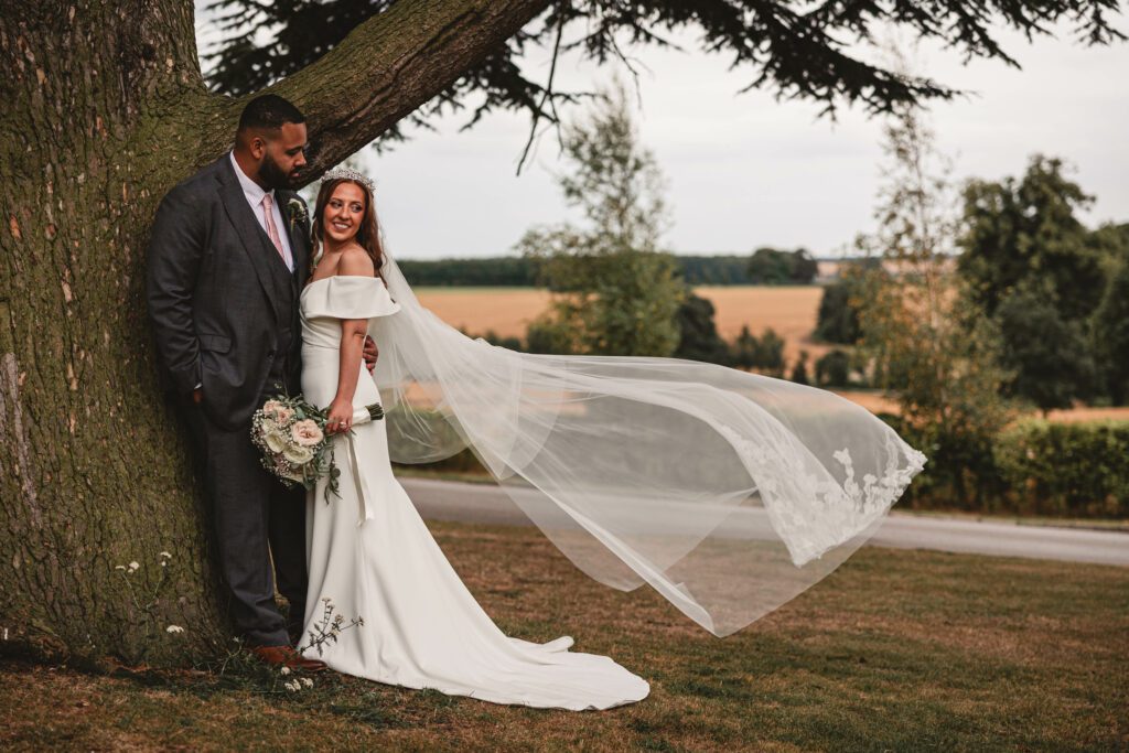 A brides vail flowing in the wind at Hazlewood castle | Yorkshire wedding photographer