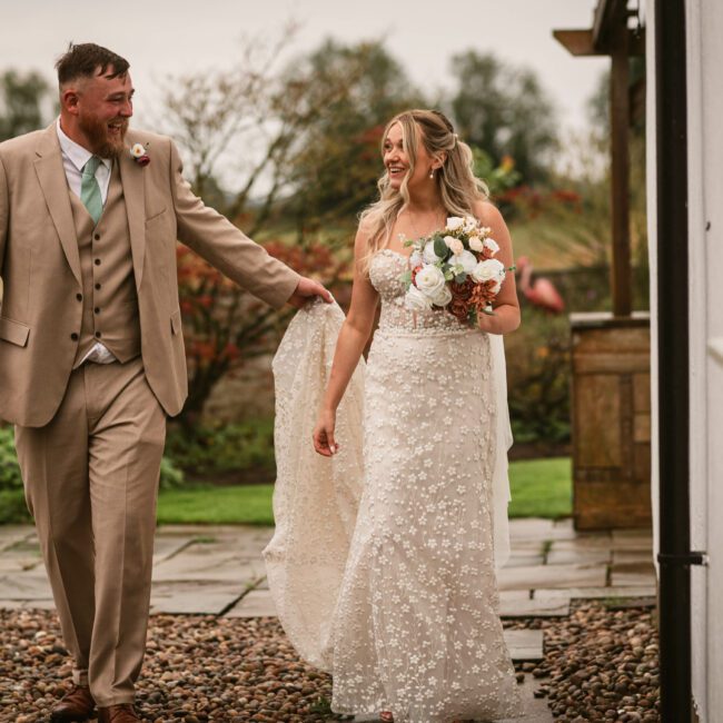 bride and groom around deighton lodge walking around