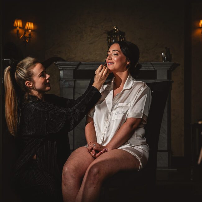 Bride getting make up done by make up artist at crab and lobster weddings venue | Yorkshire wedding photographer