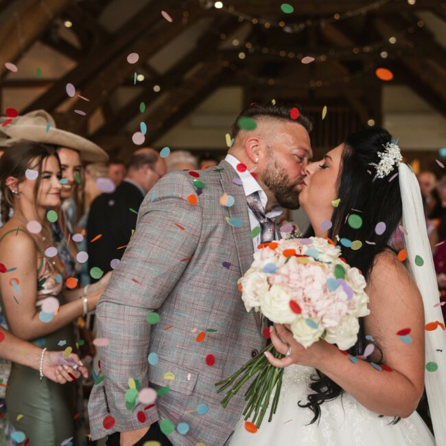 bride and groom first kiss as sandburn hall hotel